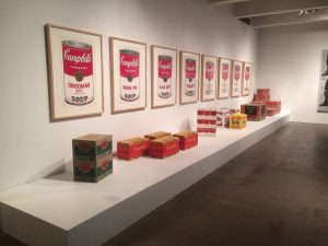 The bright red Campbell Soup paintings and Brillo boxes